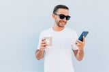 Man holding wallet and smartphone